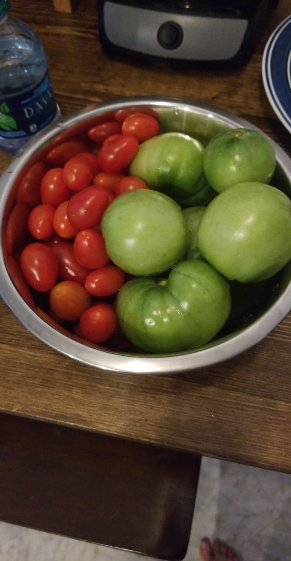 freshly picked green and red tomatoes in different sizes